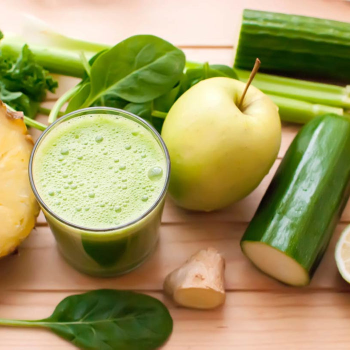 Green smoothie with pineapple, apple, cucumber and spinach