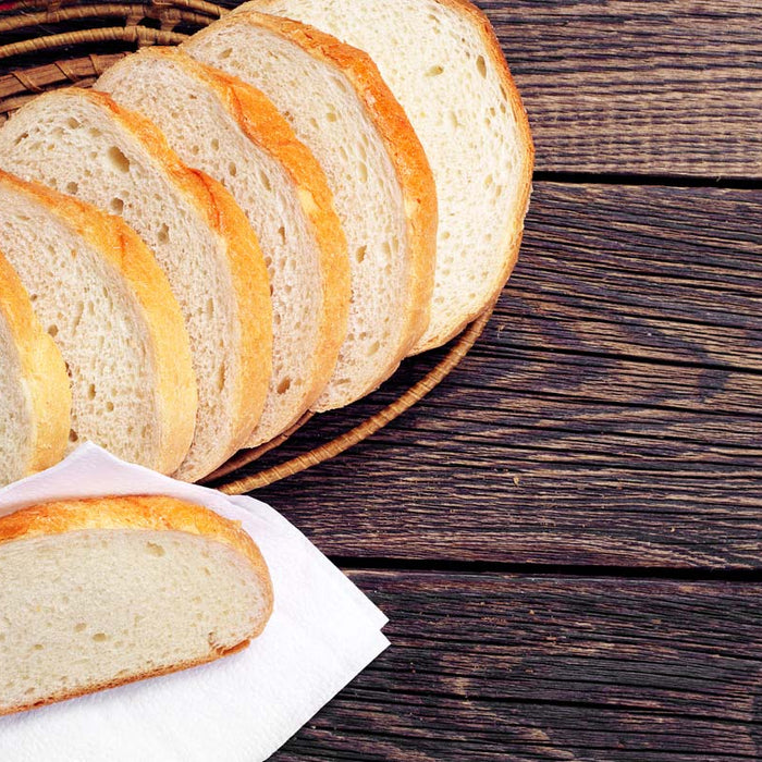 Sliced white bread on a wooden table