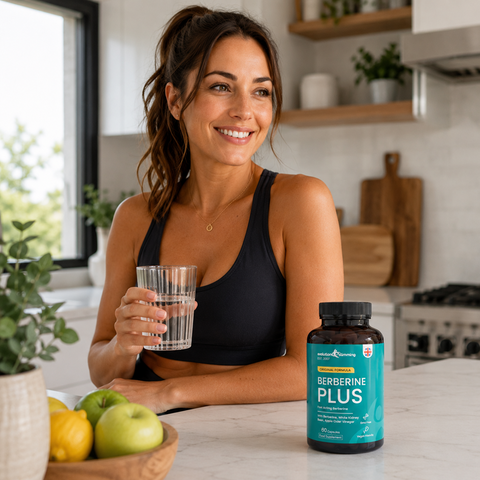 Woman holding a glass of water beside Berberine Plus